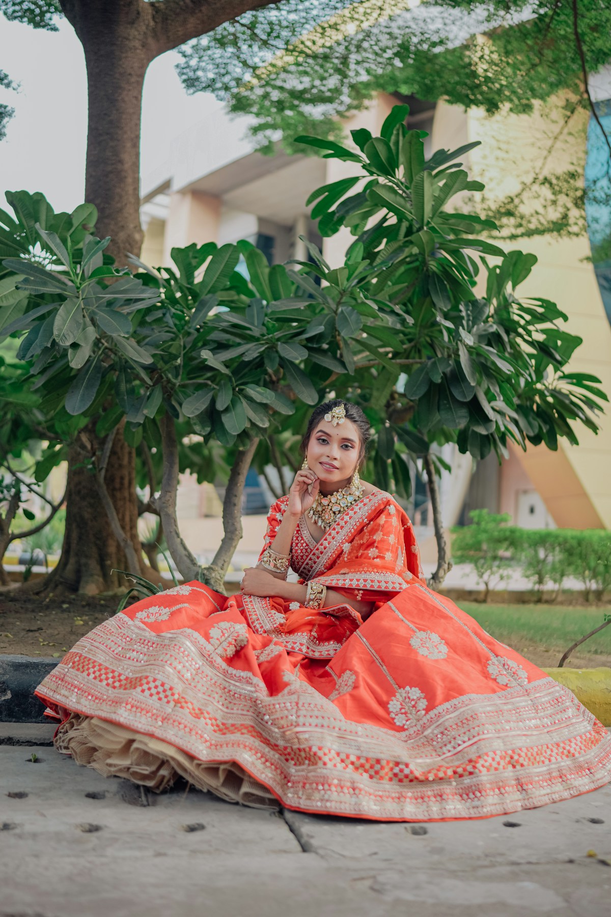 Bride in red lehenga with jewelry