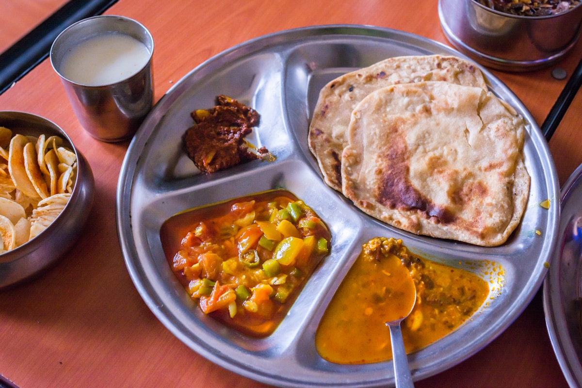 Indian food spread on decorated table